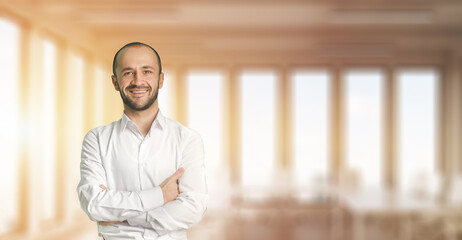 Businessman stands in the office

