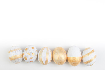 Happy Easter. Painted eggs on isolated white background. Top view. Copy space for text.