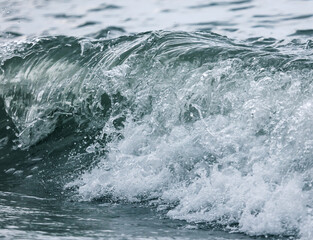 Wave in the sea with splashing water.