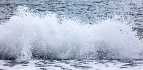 Wave in the sea with splashing water.