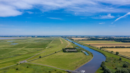 Fototapeta na wymiar Landscape with the Stoertebeker Canal by Greetsiel