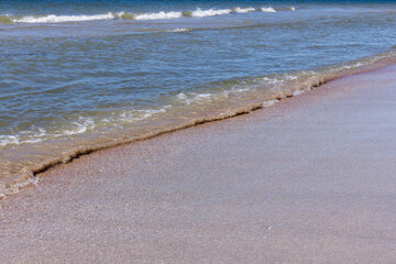 The background of sand with water splash into summer with space for text.