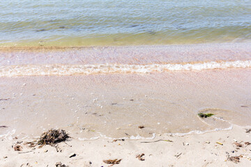 The background of sand with water splash into summer with space for text.