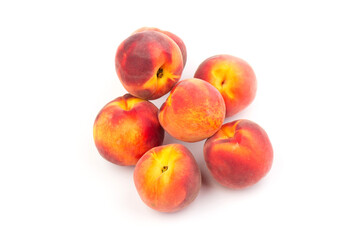 Summer fruit background. Ripe juicy peaches on white background. Copy space. Fresh organic fruit vegan food. Harvest concept