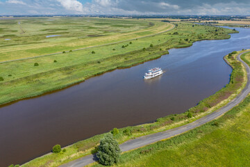 Fototapeta premium Tourist ship at the Leyhoerner-Sieltief by Greetsiel