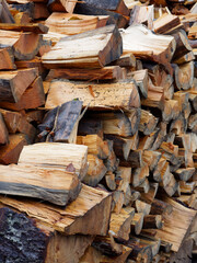 Woodpile of chopped wood damp from the rain close-up. High quality photo