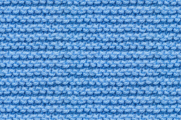Blue Knitwear Fabric Texture. Machine Knitting Texture Macro Snapshot. Blue Knitted Background.