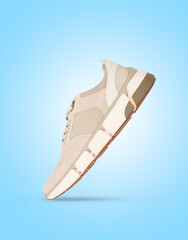 Flying Modern stylish sneakers isolated on a blue background