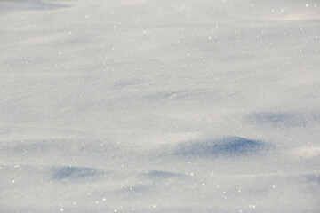white snowdrift with blue shadows, winter texture