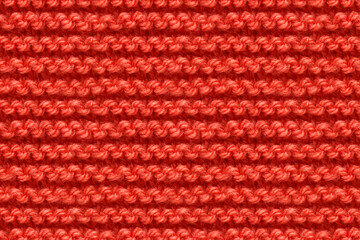 Red Knitwear Fabric Texture. Machine Knitting Texture Macro Snapshot. Knitted Background.