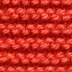 Red knitted fabric seamless pattern for borderless fill. Knitted fabric repeating pattern for background close up.