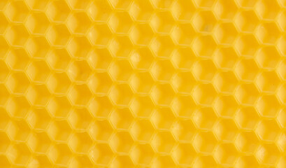 Macro photo abstract yellow background bee honeycomb wax