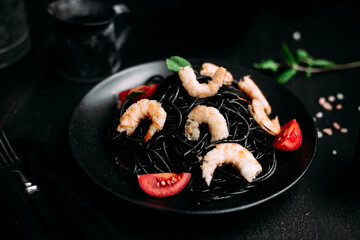 Black pasta with tiger prawns