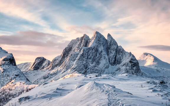 Scenery of Majestic snow mountain with footprint on Segla hill in the morning at Senja Island