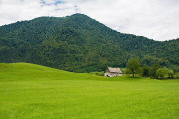 Fototapeta na wymiar The summer landscape near the village of Zatolmin in Tolmin municipality, Primorska, Slovenia. Part of the Triglav National Park 