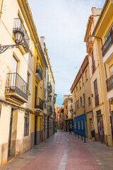Fototapeta na wymiar Castellón de la Plana, Valencian Community, Spain. Beautiful historical colorful spanish street. Typical architecture, well-preserved.