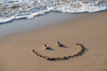 Fototapeta na wymiar smile on the sand