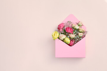 Pink flower gift on pastel background. Floral summer or spring open box with roses. Birthday, valentine or mother day concept