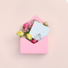 Pink flower gift on pastel background. Floral summer or spring open box with roses. White paper...