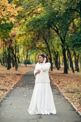 
bride walking on a sunny day