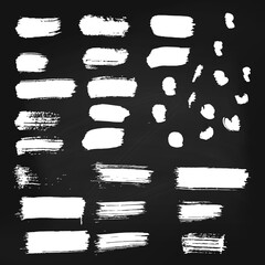 Set of vector white paint brush spots on chalkboard background. Big set of watercolor strokes isolated on black. Grunge texture, artistic design elements or text box