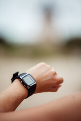 Woman checking her fitness watch while training
