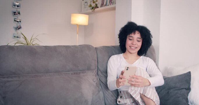 Woman having a drink while her boyfriend brings her a cup of tea