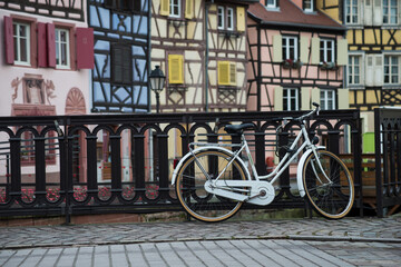 Fototapeta na wymiar view of retro bicycle on typical architecture background in Colmar - France