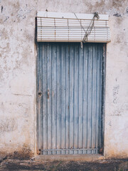 old facade with metallic door