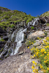 Waterfall in the lakes of Ayous near the Midi d'Ossau mountain in the Pyrenees (France)