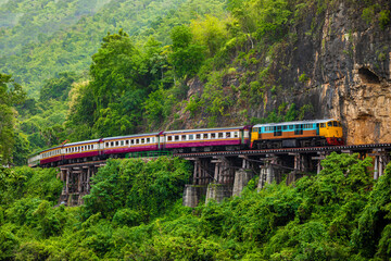 Train running on the death railway River Kwai in Kanchanaburi, Thailand.