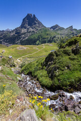Naklejka premium Waterfall in the lakes of Ayous near the Midi d'Ossau mountain in the Pyrenees (France)