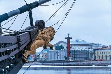 Russia, St. Petersburg, January 2021. A jumping lion on the bow of the ship and a view of the city.