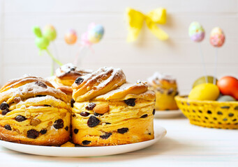 Baked Easter cakes with colored eggs. Easter card with easter baked goods and decor