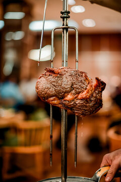 juicy beef from skewer at Brazilian steakhouse