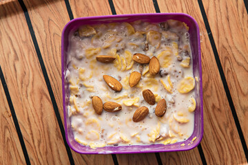 almonds and cornflakes with milk for a healthy breakfast