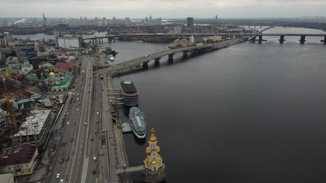 Drone view of a big city with a river and a bridge