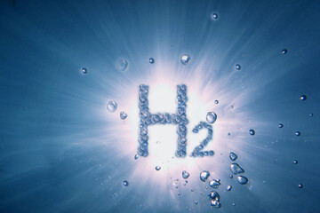 letters hydrogen h2 with lot of bubbles in a blue water with sun