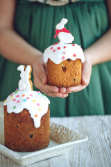 The child is holding an Easter cake. Birthday cake. High quality photo.