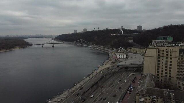Crossing bridge over the dnieper in cloudy weather