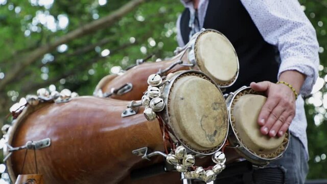 Percussionist man playing a bat&aacute; drum