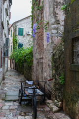An old delivery tricycle in an otherwise empty alley in the old town, Kotor, Montenegro