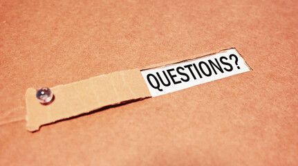 QUESTIONS text appearing behind torn paper. Feedback.