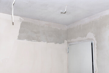 Freshly laid gypsum on the walls and ceiling of a newly built detached house.