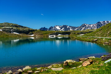 Fototapeta na wymiar Passo Gavia, mountain pass in Lombardy, Italy, at summer. Lake
