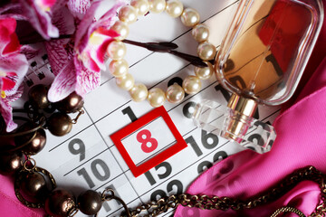 Date white block calendar for International Women's Day, March 8, orchid flower and perfume
