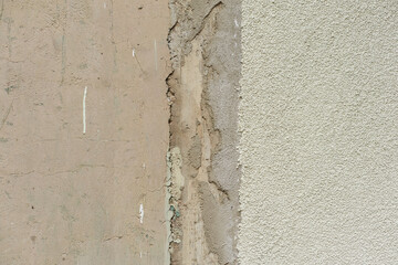 Grey texture of old broken asphalt road or wall big abrasions cracks holes on the surface pebbles cement in Sofia, Bulgaria, Eastern Europe