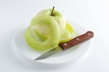 Green apple on a plate