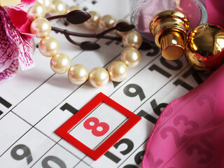 March 8 on the calendar, women's holiday, pearl bracelet and perfume
