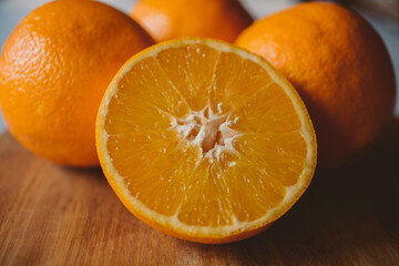 Ripe oranges on wooden background. organic fruit. 